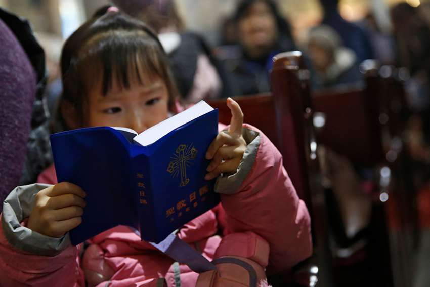 Catholics see restrictions as new religion rules take effect in China