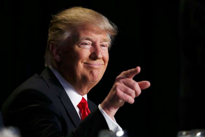 Trump defends refugee ban as part of protecting religious freedom