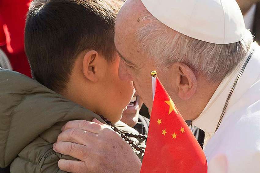 Pope Francis shares a moment with Chinese pilgrims at general audience