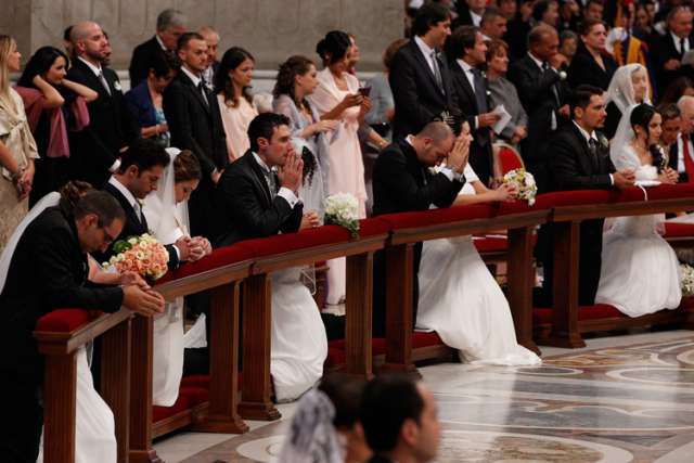 At wedding, Pope Francis says spouses make each other better men and women