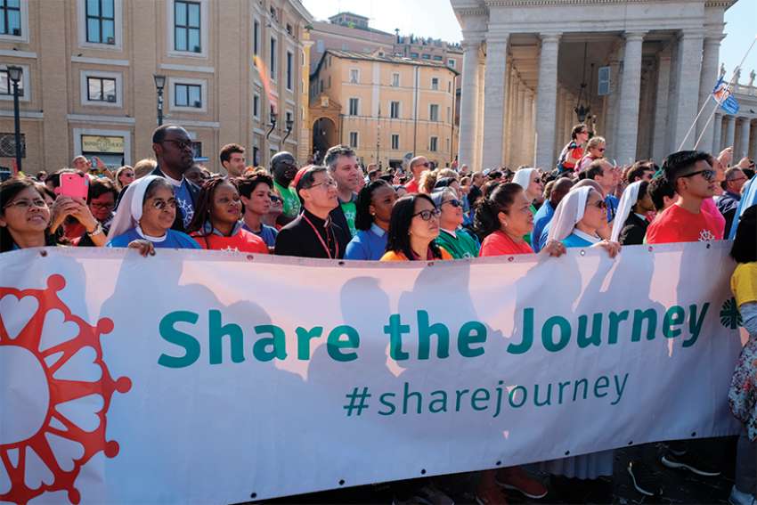 Synod members walk to 'share the journey' with migrants, refugees