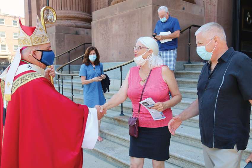 Come back to Mass, archbishop pleads