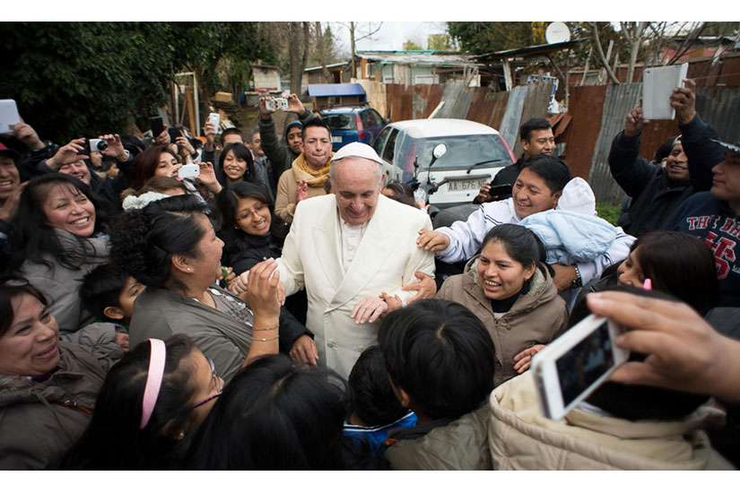 Pope makes surprise visit to immigrant settlement before parish visit