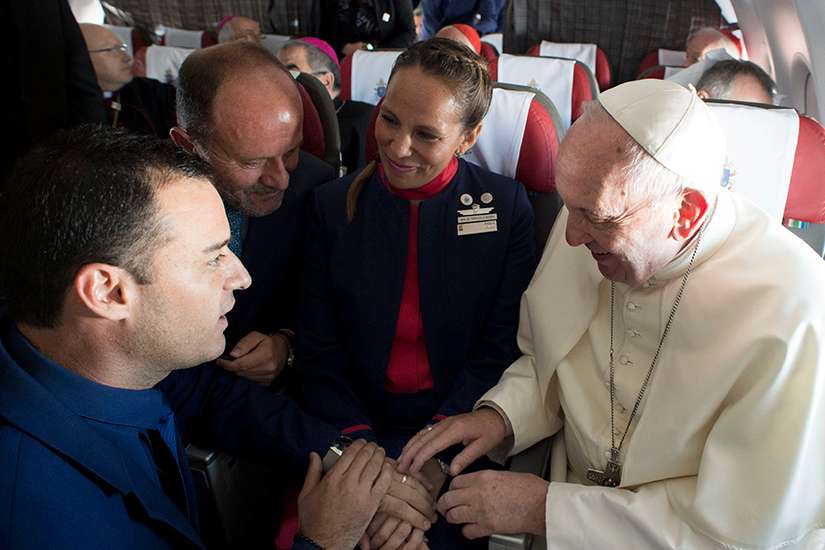Reach out to cohabitating couples, support newlyweds, Pope urges