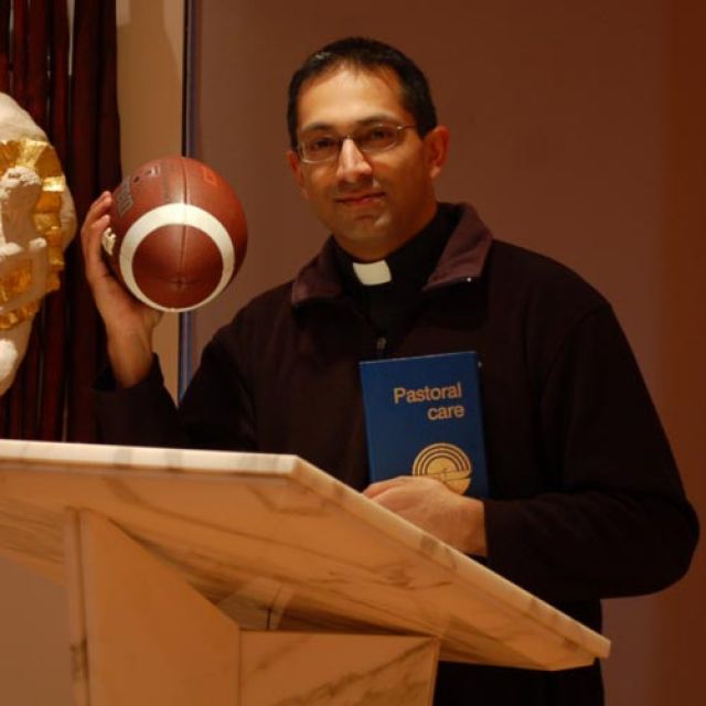 When the Bills come to play, priest helps them pray