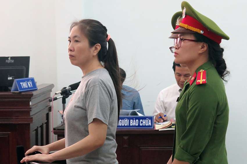 Vietnam releases, then exiles jailed Catholic blogger, human rights activist
