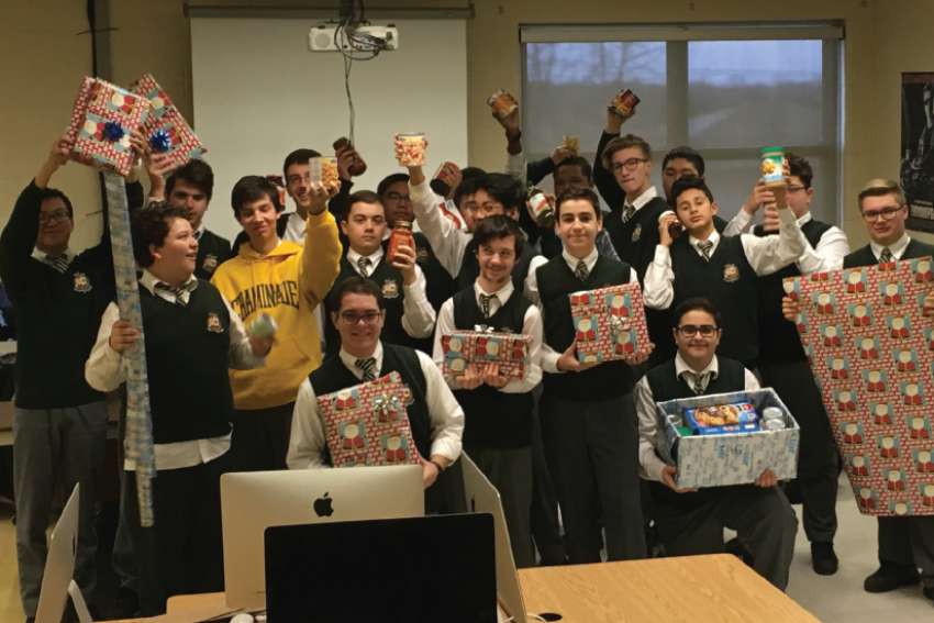 High school students bring Christmas cheer to needy